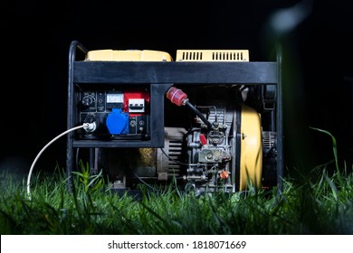 street lighting. night. The generator is yellow. Generates electricity. Used as a backup power supply. - Shutterstock ID 1818071669