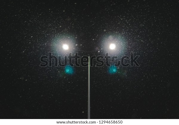 street lighting, supports for ceilings with led\
lamps. concept of modernization and maintenance of lamps, place for\
text, night. winter season. energy-saving lamps, safety of\
movement