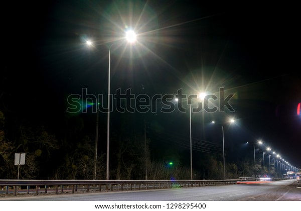 street lighting, supports for ceilings with led
lamps. concept of modernization and maintenance of lamps, place for
text, night. winter season. energy-saving lamps, safety of
movement