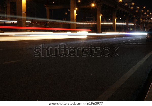 Street lights in speeding car, light motion with\
slow speed shutter.