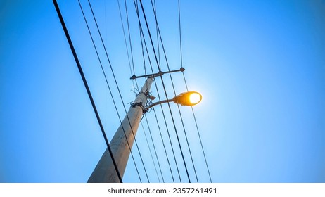 Street lights that start to come on just before sunset, industrial - Shutterstock ID 2357261491