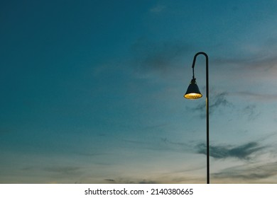 The street lights were on in the twilight before the sky darkened. - Shutterstock ID 2140380665