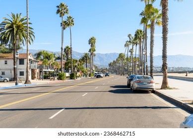 Street lined with palm trees on Santa Barbara beachfront on a clear autumn morning - Powered by Shutterstock