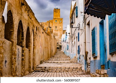 A street in Medina in Sousse, Tunisia. Magical space of medieval town with colorful walls and stone pavement.