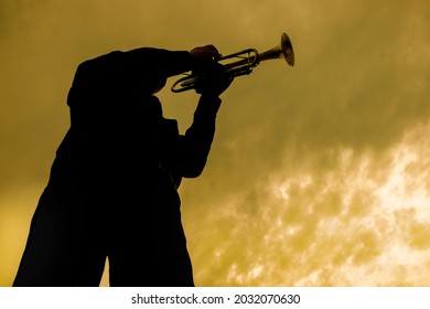 Street Musician In A Black Shirt Plays The Trumpet