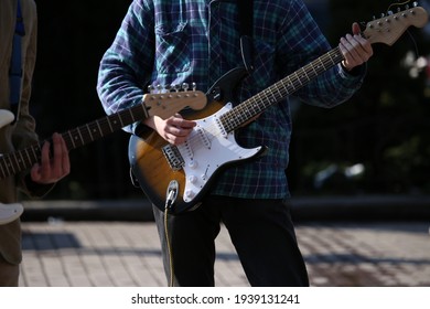 Street Musician With Electric Guitar In His Hands