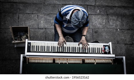 Street Musician On The Piano, View From Above