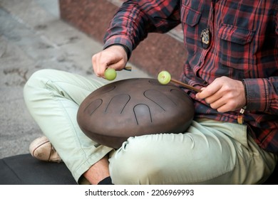 Street Musician Playing The Drum