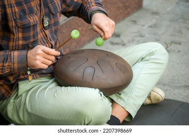 Street Musician Playing The Drum