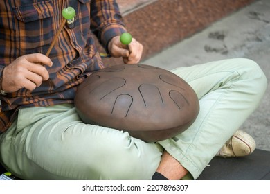 Street Musician Playing The Drum