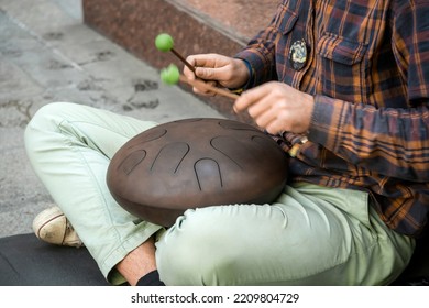 Street Musician Playing The Drum