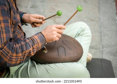 Street Musician Playing The Drum