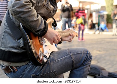 A Street Musician Plays Guitar On The Square