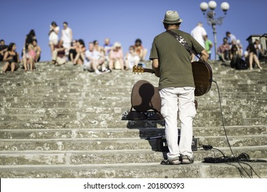 Street Musician Singing In Front Of A Crowd