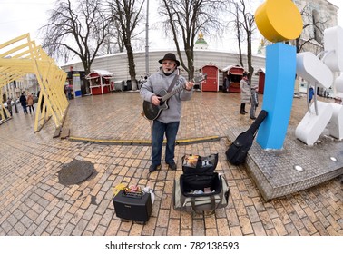 Street Musician,busker, Playing Electric Guitar On Sofievskaya Square During Christmas Market. December 12, 2016. Kiev, Ukraine   