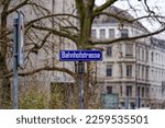 Street name sign of Bahnhofstrasse at City of Zürich on a gray and cloudy winter day. Photo taken February 8th, 2023, Zurich, Switzerland.