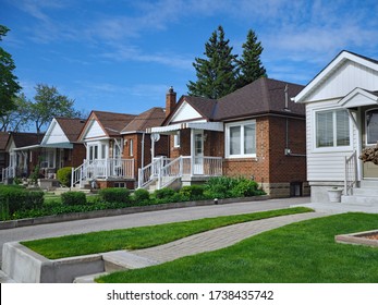 street with old fashioned 1950s style working class bungalows