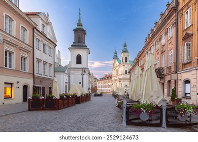 Street in the old town with historical buildings, colorful facades, church and street cafes in the early morning, Warsaw, Poland - Powered by Shutterstock