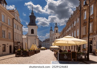 Street in the old town with historical buildings, colorful facades, church and street cafes, Warsaw, Poland - Powered by Shutterstock