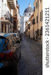 Street parking on narrow streets of Castel Gandolfo, summer residence of pope, view on green Alban hills overlooking volcanic crater lake Albano, Castelli Romani, Italy in summer