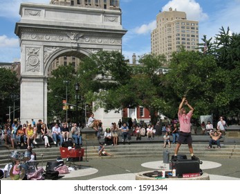 Street Performer Swallowing Sword In Washington Square, New York City