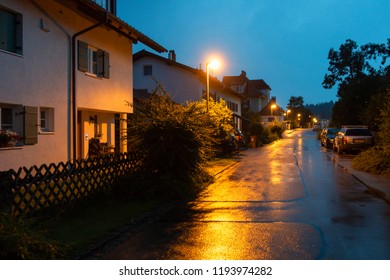 Street perspective. Street in the European city. Night street, rain, wet asphalt. - Powered by Shutterstock