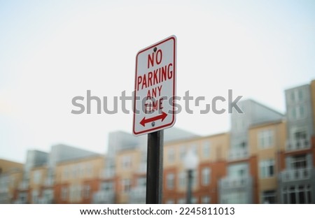 street photography graffiti lamps park signs stop no parking signs pigeons traffic lights fences sunset light 