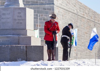 Grande-Allée Street, Quebec City, Quebec, Canada, November 11, 2018 - Royal Canadian Mounted Policeman And Member Of The Naval Reserve Standing Guard At The Cross Of Sacrifice