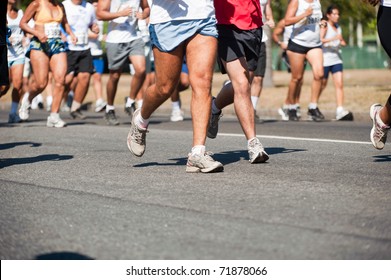 Street race, showing the legs of the runners