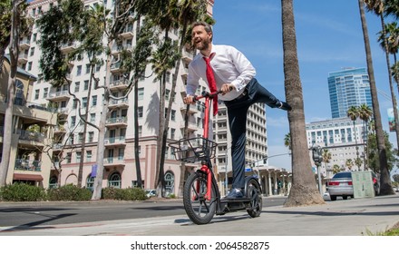 Street Recreation. Happy Employer Ride Escooter On Sidewalk. E-scooting For Recreation And Fun