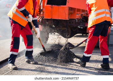 Street resurfacing. Fresh asphalt construction. Bad road - Shutterstock ID 2154969737