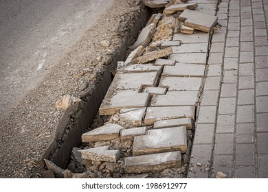 Street Sidewalk Damaged Pavement With Trench Along. Street Repair Works Urban Decay.