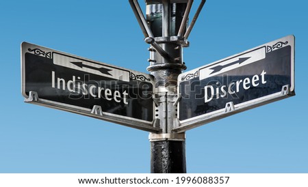 Street Sign the Direction Way to Discreet versus Indiscreet