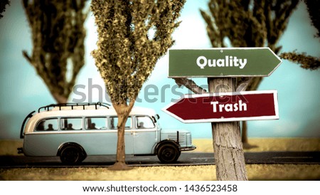 Street Sign the Direction Way to Quality versus Trash