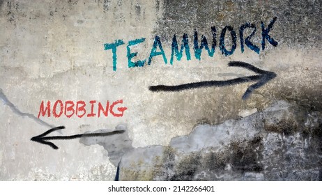 Street Sign the Direction Way to Teamwork versus Mobbing - Shutterstock ID 2142266401