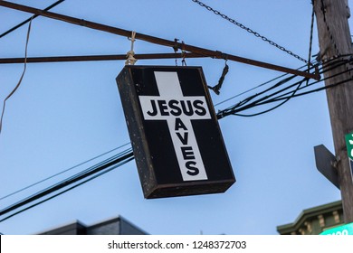 A street sign featuring "Jesus Saves"