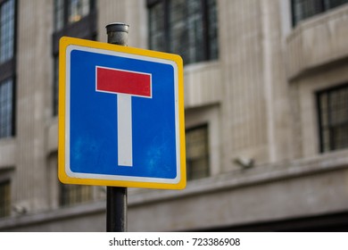 A street sign in London indicates to drivers that the road is a dead end, with no through route for traffic