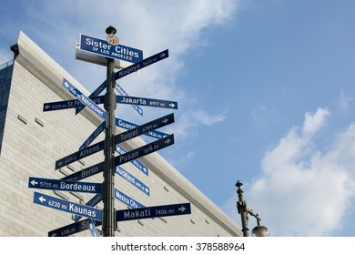 Street Sign With The Sister Cities Of Los Angeles And City Hall 