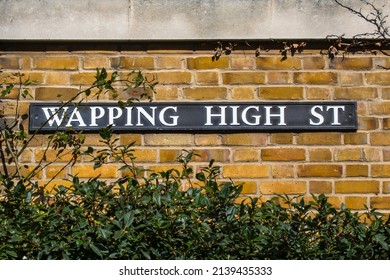Street sign for Wapping High Street, located In the London Borough of Tower of Hamlets in London, UK.