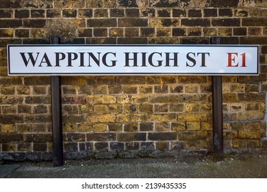 Street sign for Wapping High Street, located In the London Borough of Tower of Hamlets in London, UK.