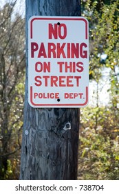 Street Sign Which Reads In Bright Red Letters: 