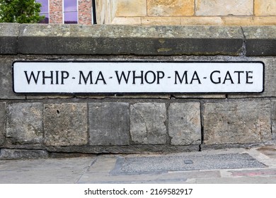 Street sign for Whip-Ma-Whop-Ma-Gate in the city of York, UK.