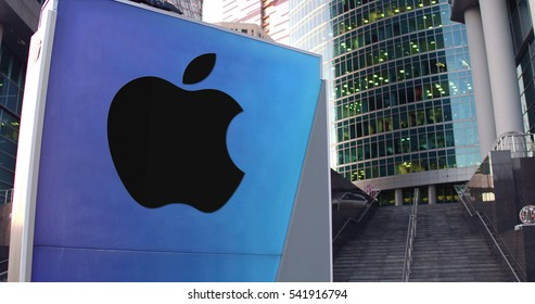 Street Signage Board With Apple Inc. Logo. Modern Office Center Skyscraper And Stairs Background. Editorial 3D Rendering