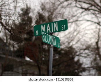 Street Signs At The Corner Of Main Street And Second