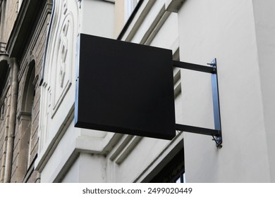 Street storefront shop, cafe, restaurant mounted signboard mock up design template. Blank white store sign design mockup.