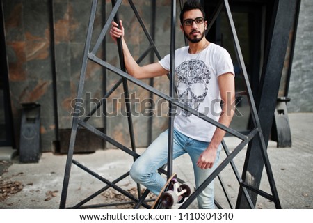 Similar – Thoughtful young man sitting on an urban bench