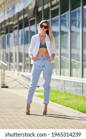 Street Style Fashion - Lady In White Shirt And Boyfriend Jeans Walking Along Business Centre