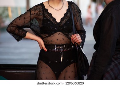 Street Style Image Of Woman Wearing Transparent Black Dress, Mid Section, Horizontal 