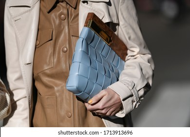 street style outfit - woman wearing cream coat and blue handbag - StreetStyleFW2020