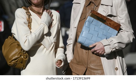 street style outfit - woman wearing cream coat and blue handbag - StreetStyleFW2020